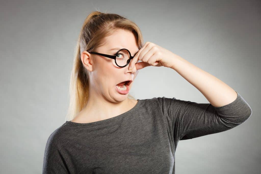 woman pinching her nose photo